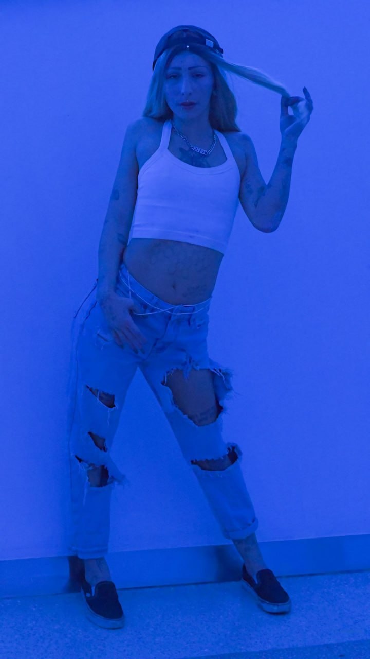 Veyra in a blue studio